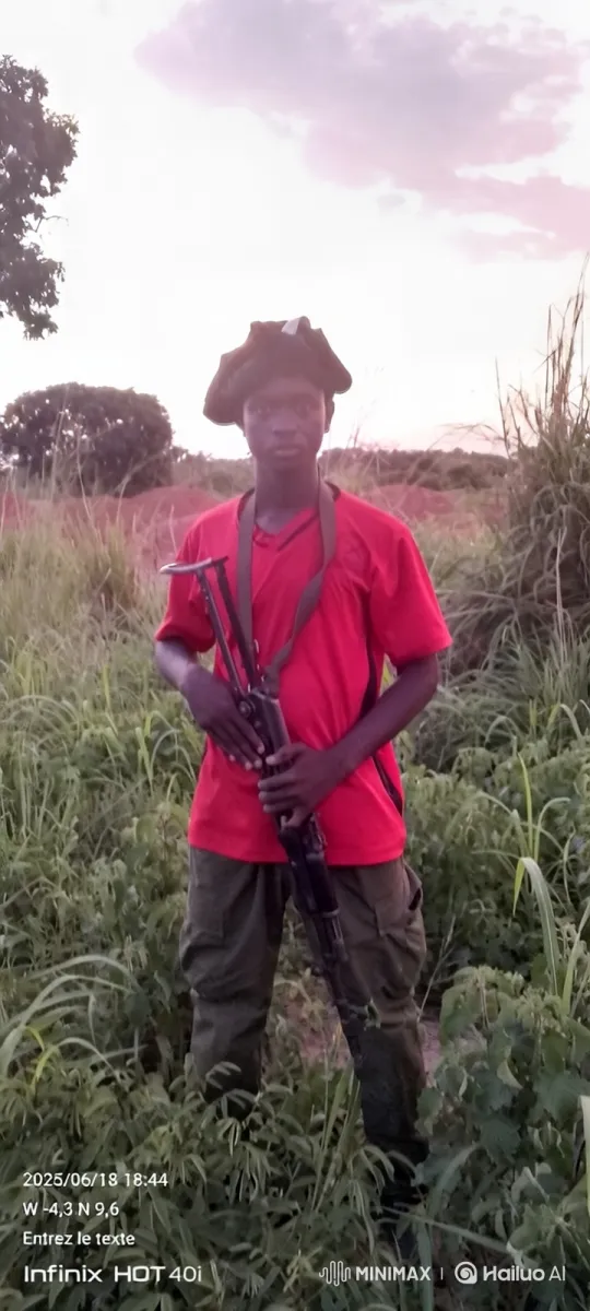 Young Man Awaits Arrival of Vehicles in Dusk-Lit Field – AI Generated Video | Hailuo AI