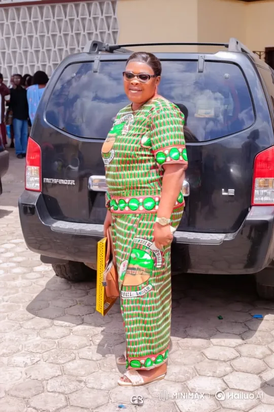 Woman in Patterned Outfit Enters Red Sedan – AI Generated Video | Hailuo AI