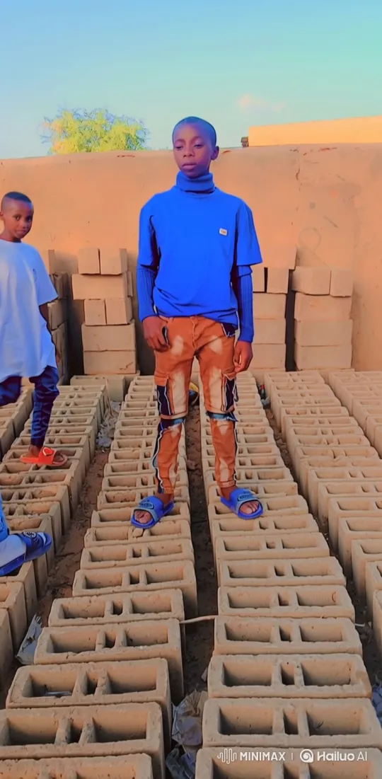 Young Boy Stands Firm in Expansive Brickyard – AI Generated Video | Hailuo AI
