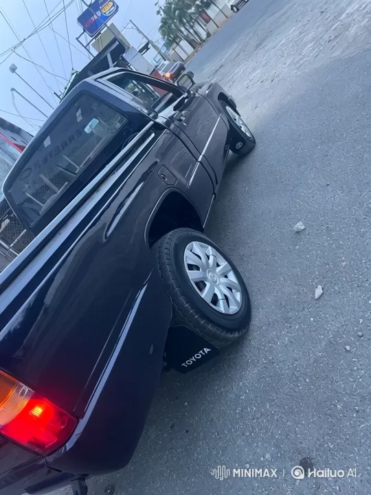 Pickup Truck Lowering on Urban Street with Hazy Sky – AI Generated Video | Hailuo AI