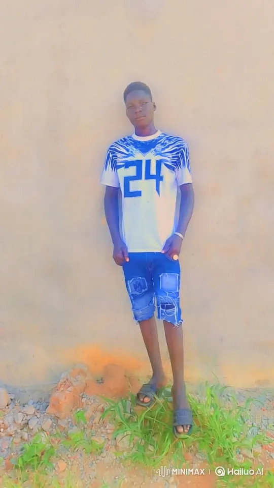 Young Man in White Tee Stands by Beige Wall – AI Generated Video | Hailuo AI