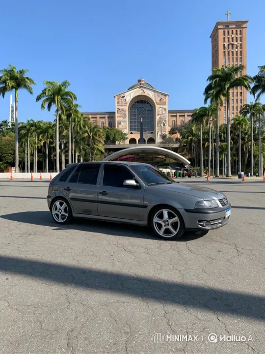 Grey Hatchback Transforms with Graceful Lowering in Sunlit Lot – AI Generated Video | Hailuo AI