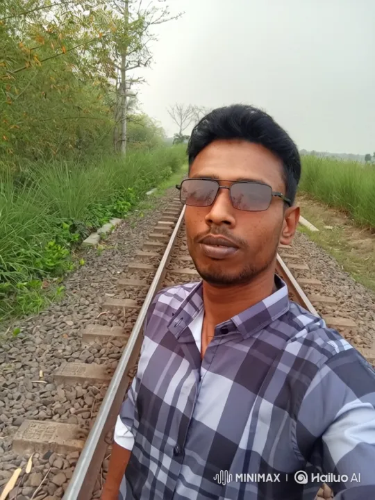 Man Walks Along Railway Track in Rural Setting – AI Generated Video | Hailuo AI