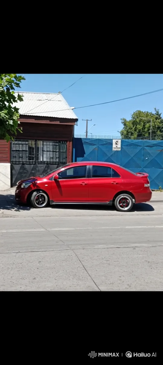 Custom Red Sedan Lowers on Quiet Street – AI Generated Video | Hailuo AI