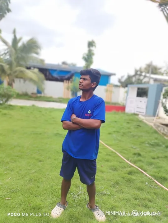 Young Man in Thoughtful Pose Amidst Gentle Breeze – AI Generated Video | Hailuo AI