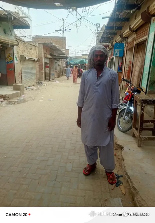 Man Watches Helicopter Fly Over Dusty Town Street – AI Generated Video | Hailuo AI