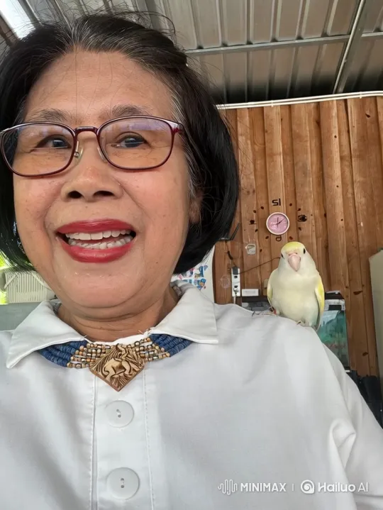 Older Woman Laughs Joyously with Bird on Shoulder – AI Generated Video | Hailuo AI