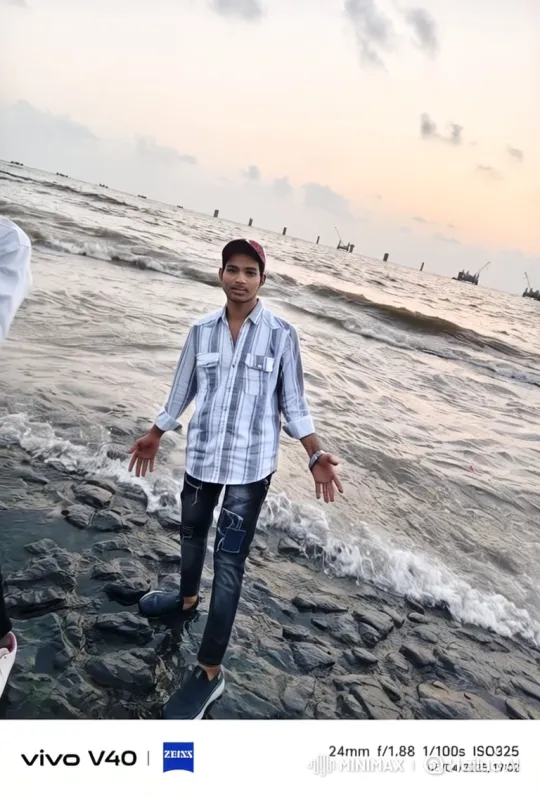 Young Man Contemplates at Dusk on Rocky Shore – AI Generated Video | Hailuo AI