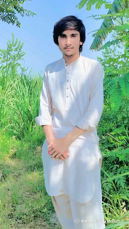 Young Man Smiles Gently in a Verdant Field – AI Generated Video | Hailuo AI