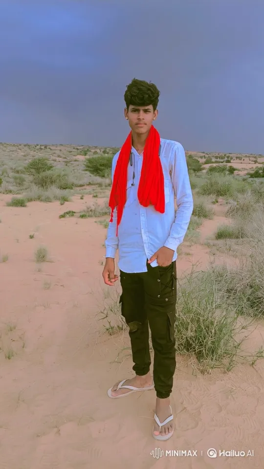 Young Man Reflects in Sandy Landscape with Scarf – AI Generated Video | Hailuo AI