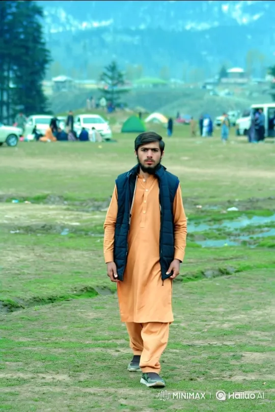 Young Man Walks Towards Camera in Meadow – AI Generated Video | Hailuo AI