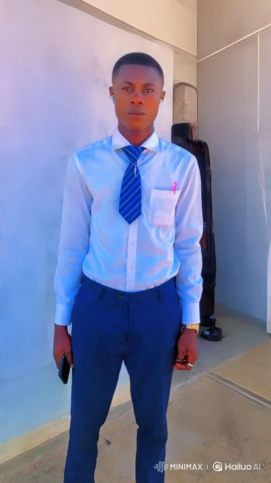 Young Man in Business Attire, Filmed in Modern Building Setting – AI Generated Video | Hailuo AI