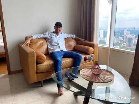 Couple Enjoying Romantic Moment on Sofa with City View – AI Generated Video | Hailuo AI