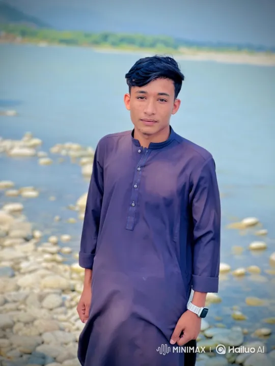 Young Man on Shore Amidst Tranquil Nature – AI Generated Video | Hailuo AI