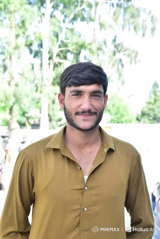 Young Man with Warm Smile and Gentle Nod in Outdoor Setting – AI Generated Video | Hailuo AI