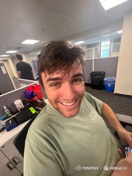 Young Man's Face Transforms Violently in Office Setting – AI Generated Video | Hailuo AI