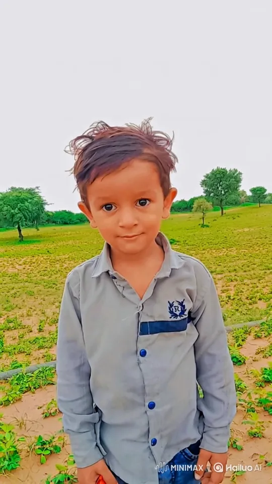 Young Boy in Green Field with Gentle Breeze – AI Generated Video | Hailuo AI
