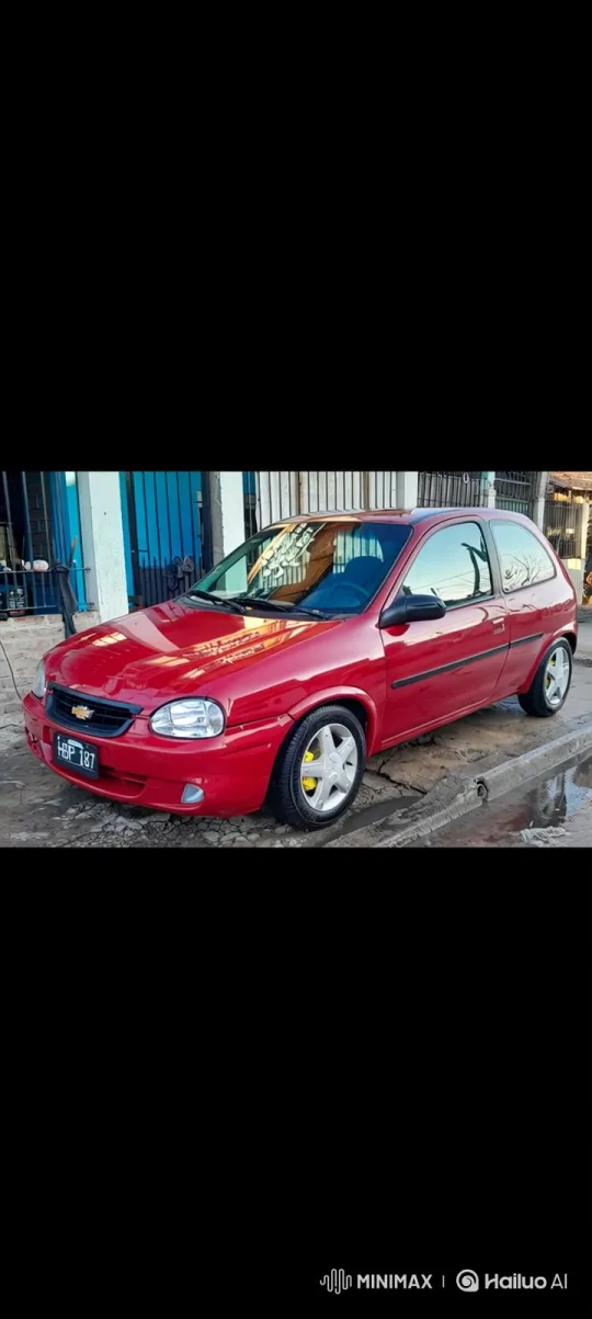 Red Hatchback Lowers on Wet Driveway with Grace – AI Generated Video | Hailuo AI