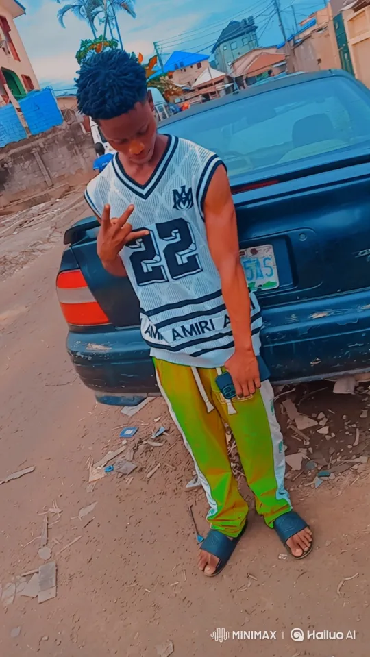 Young Man in Casual Pose Against Sedan on Dirt Road – AI Generated Video | Hailuo AI