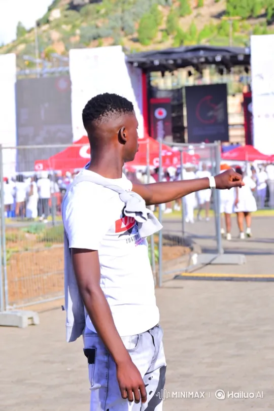 Young Man Walks to Car at Outdoor Festival – AI Generated Video | Hailuo AI