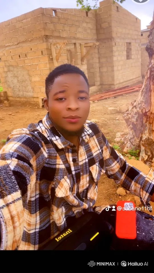 Young Man Smiles Gently in Outdoor Setting – AI Generated Video | Hailuo AI