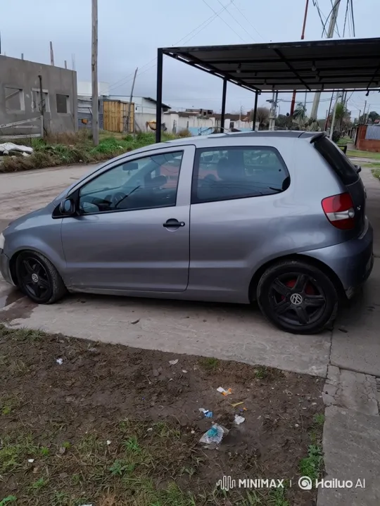 Grey Hatchback Lowers on Driveway with Air Suspension – AI Generated Video | Hailuo AI