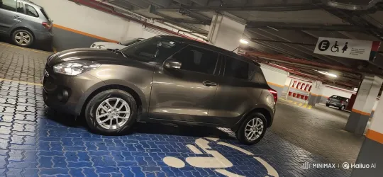 Indoor Parking Garage: Metallic Hatchback Simulates Air Suspension Deflation – AI Generated Video | Hailuo AI