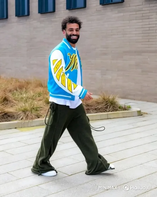 Stylish Man in Letterman Jacket Walks with Confidence – AI Generated Video | Hailuo AI