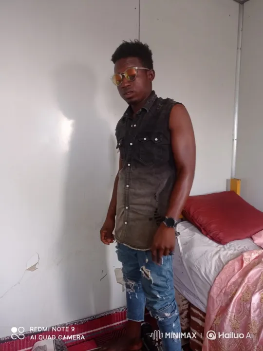 Young Man Poses Stylishly in Minimalist Room – AI Generated Video | Hailuo AI