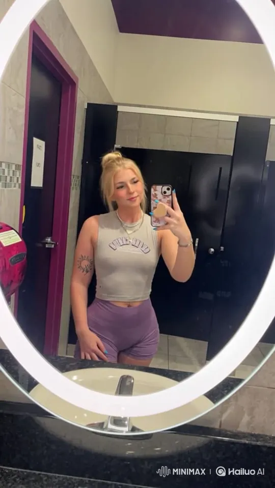 Young Woman Enjoying Dance in Locker Room Mirror – AI Generated Video | Hailuo AI