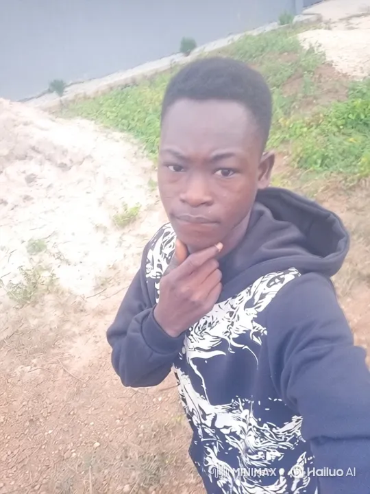 Young Black Man in Black Hoodie with Contemplative Stance – AI Generated Video | Hailuo AI
