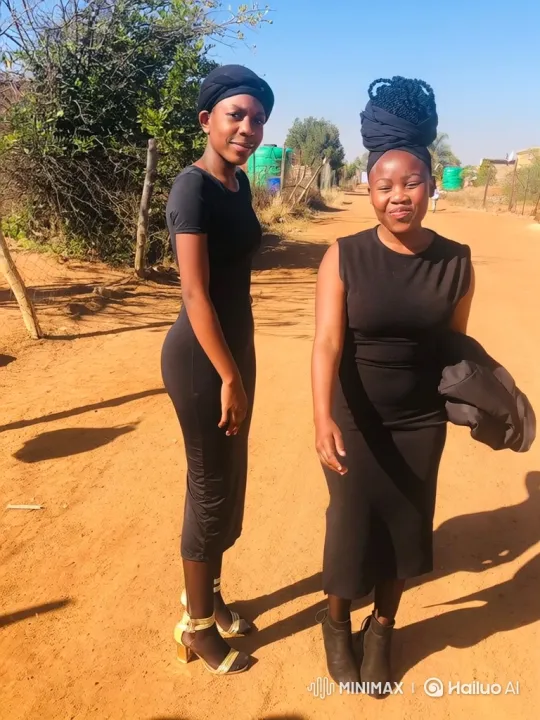 Two Women in Black on a Dusty Road – AI Generated Video | Hailuo AI