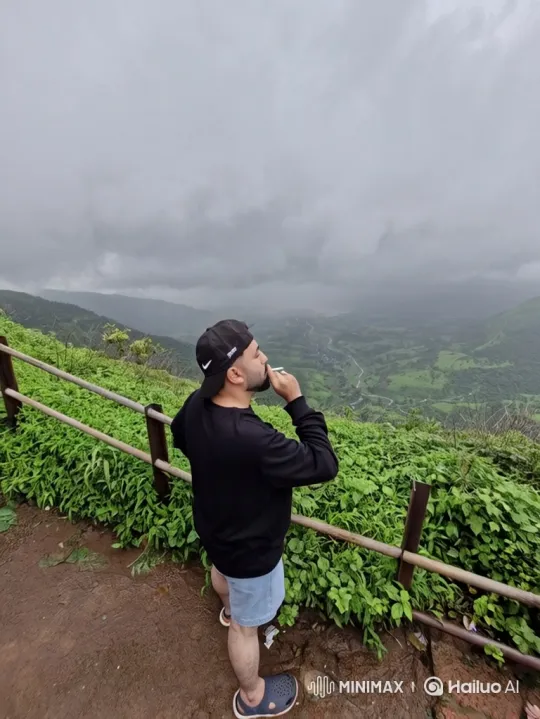 Man Contemplates Scenic Valley View in Overcast Day – AI Generated Video | Hailuo AI
