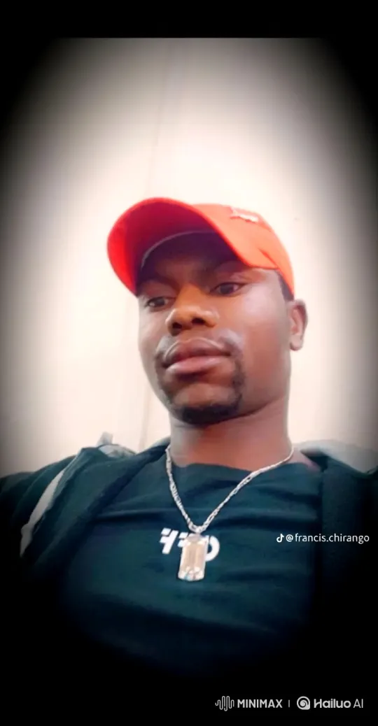 Young Man in Red Cap Holds Steady Gaze – AI Generated Video | Hailuo AI