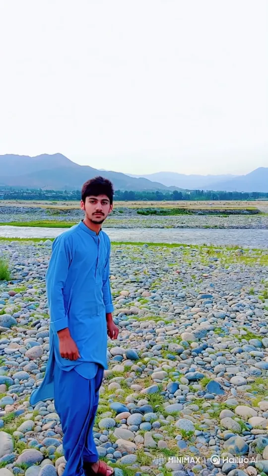 Young Man in Serene Landscape: A Tranquil Moment – AI Generated Video | Hailuo AI