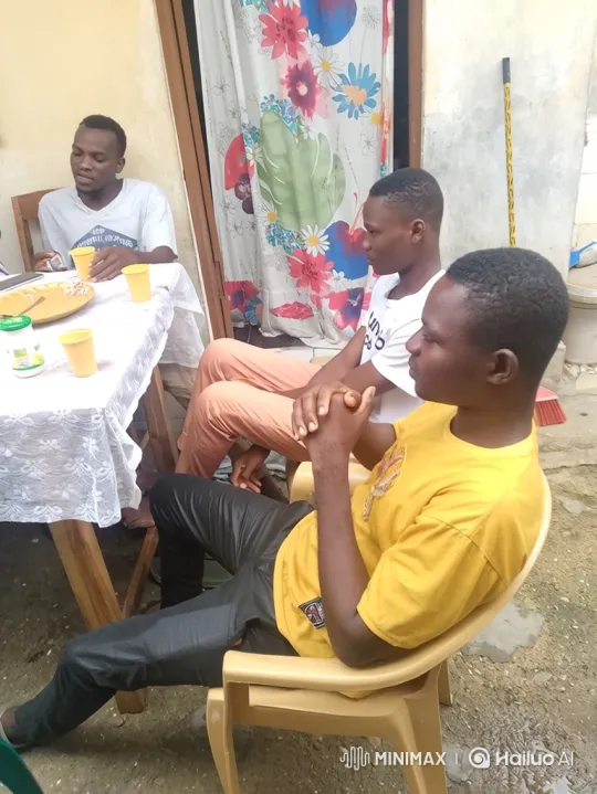 Young Men Sharing Meal and Stories at Patio Table – AI Generated Video | Hailuo AI