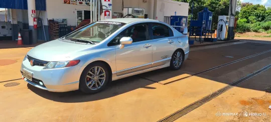 Silver Sedan Showcases Dynamic Air Suspension at Gas Station – AI Generated Video | Hailuo AI