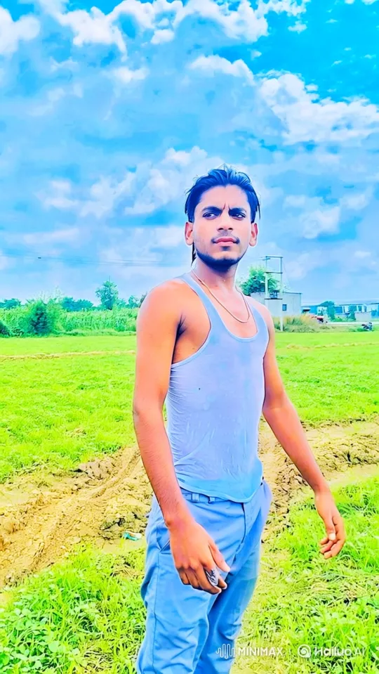 Young Man in Serene Field with Focused Gaze – AI Generated Video | Hailuo AI