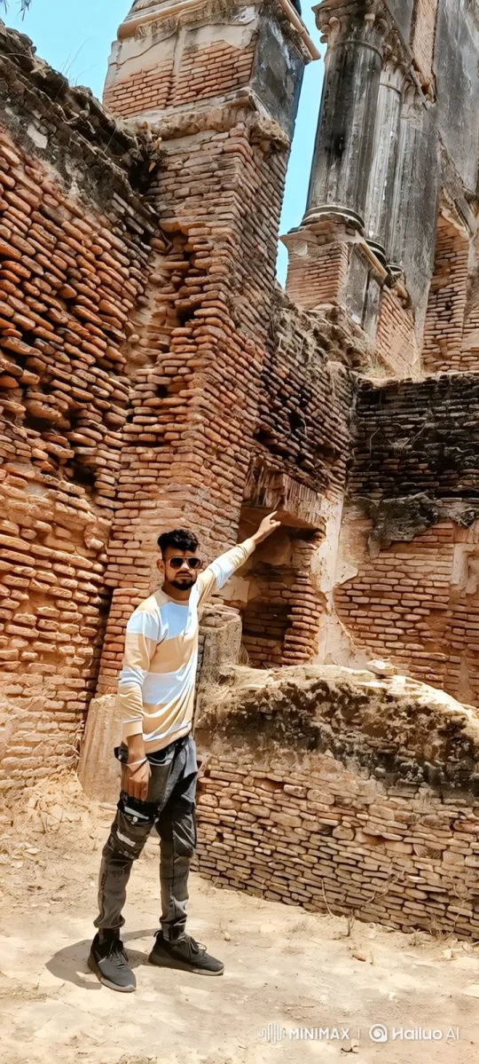 Young Man Examines Ancient Ruins with Thoughtful Touch – AI Generated Video | Hailuo AI