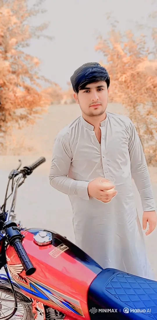Young Man on Path with Motorcycle Amidst Autumn Leaves – AI Generated Video | Hailuo AI