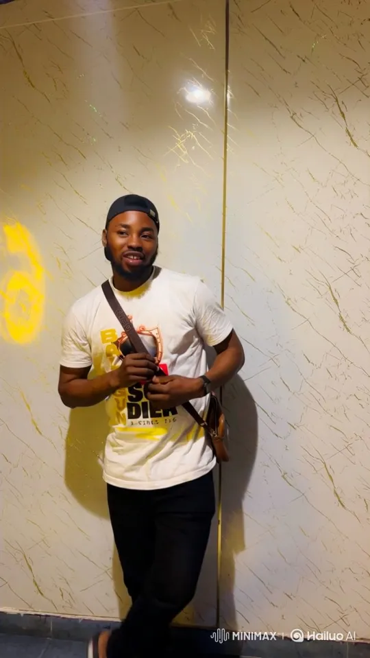 Young Man in Graphic T-Shirt Greeting with Smile – AI Generated Video | Hailuo AI