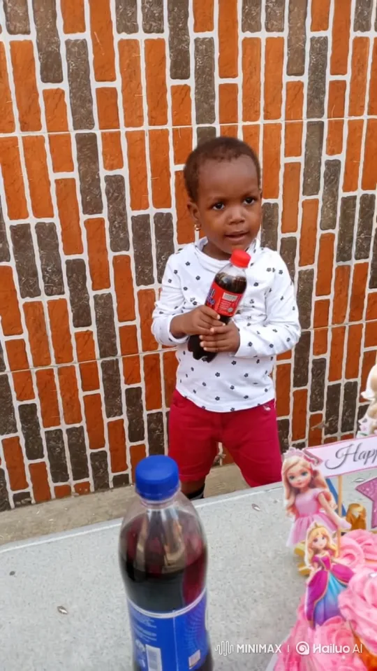 Young Black Toddler Smiles with Soda Amidst Celebration Decor – AI Generated Video | Hailuo AI