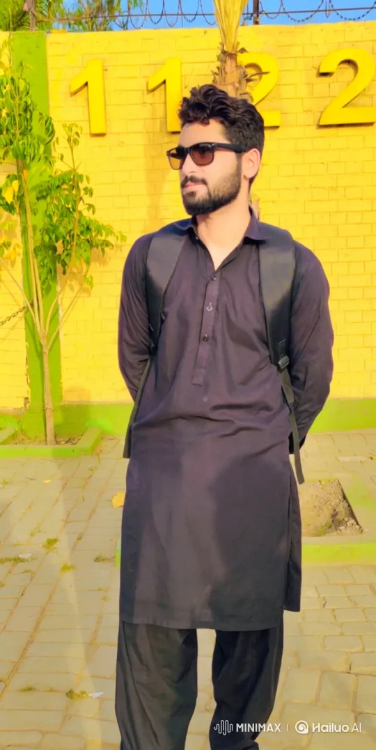Young Bearded Man in Black Clothing Turns to Camera – AI Generated Video | Hailuo AI