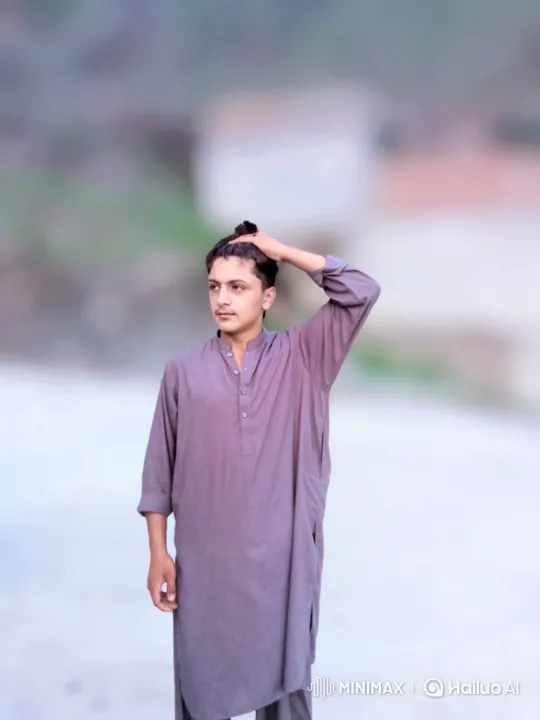 Young Man Reflects Outdoors in Calm, Contemplative Moment – AI Generated Video | Hailuo AI