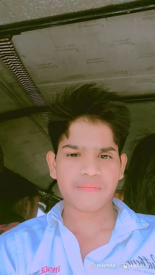 Close-up of Young Man in Moving Vehicle with Soft Smile – AI Generated Video | Hailuo AI