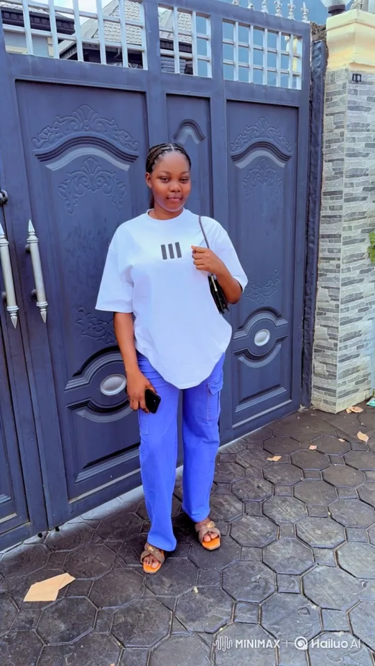 Young Woman in Casual Outfit at Blue Gate – AI Generated Video | Hailuo AI