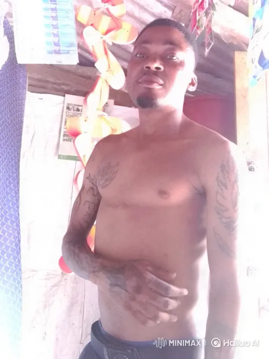 Tattooed Man in Static Pose with Subtle Movements – AI Generated Video | Hailuo AI
