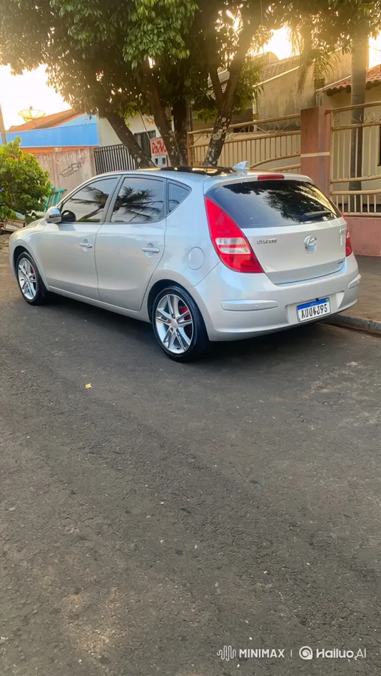 Silver Hatchback Demonstrates Air Suspension in Sunset Setting – AI Generated Video | Hailuo AI
