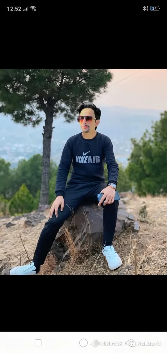 Couple Shares Affectionate Moment on Hillside Rock – AI Generated Video | Hailuo AI
