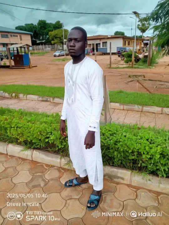 Serene Live2D Scene: Man in White at Hedge – AI Generated Video | Hailuo AI